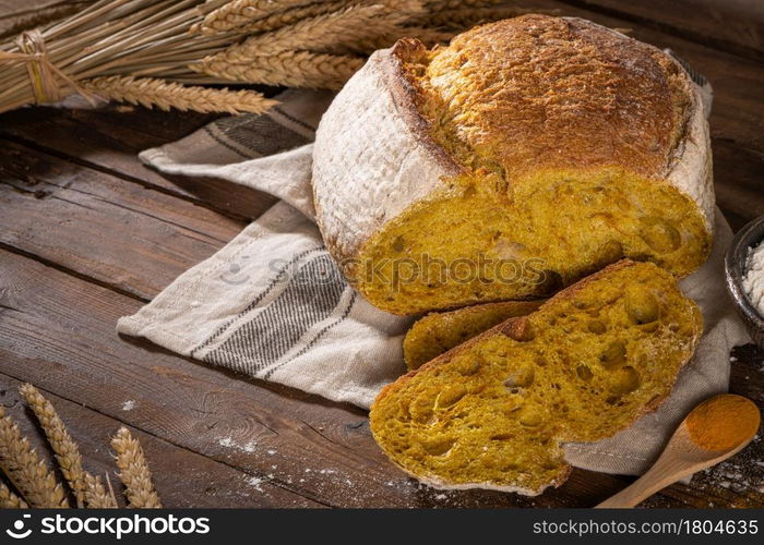 Freshly artisan baked wheat, turmeric and rye bread, country bread. Simple bread for breakfast