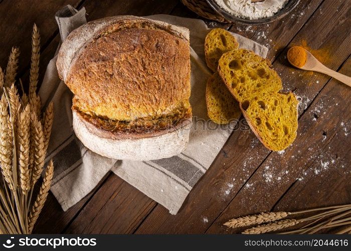 Freshly artisan baked wheat, turmeric and rye bread, country bread. Simple bread for breakfast