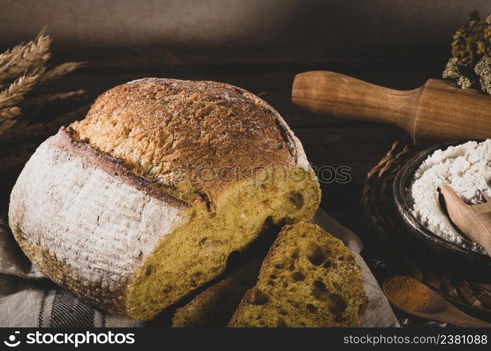 Freshly artisan baked wheat, turmeric and rye bread, country bread. Simple bread for breakfast