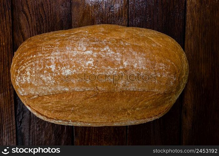 Freshly baked bread on a wooden board. Homemade bread.