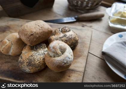 Freshly Baked Bread Rolls On A Kitchen Table