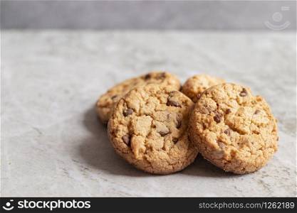 Freshly baked cookies placed on marbled texture