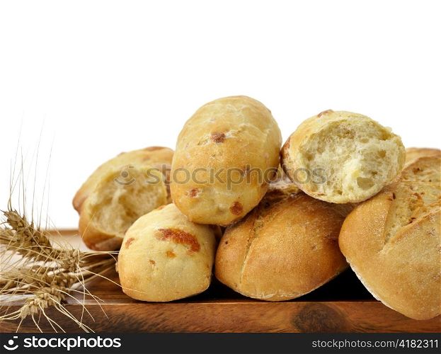 Freshly baked french bread on a wooden board on white background