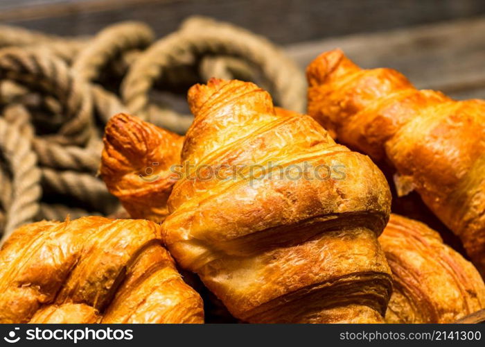 Freshly baked golden brown French croissants. Tasty baked croissants, warm buttery croissants and baked pastries