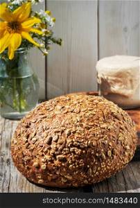 Freshly baked homemade grain bread, closeup. The concept of a healthy diet made from natural products, traditional craft bread made with natural sourdough