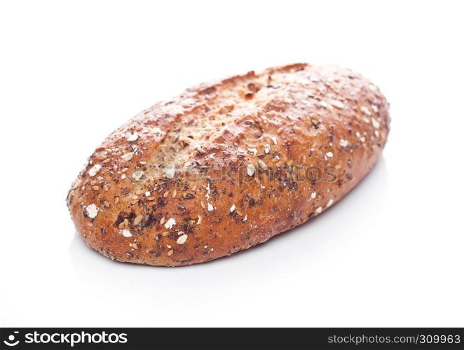 Freshly baked loaf of bread with oats on white background