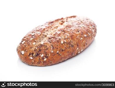 Freshly baked loaf of bread with oats on white background