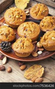 Freshly baked pumpkin muffins with nut.Autumn dessert.Fall baking. Homemade delicious pumpkin muffin