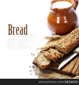 Freshly baked traditional bread and milk on white background. With easy removable sample text