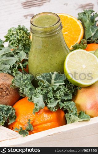 Freshly blended green coctail from fruits and vegetables. Concept of diet and healthy nutrition. Freshly blended green coctail from fruits and vegetables. Diet and healthy nutrition concept