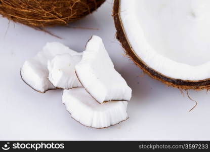 freshly cut coconut and milk isolated on white background