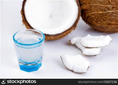 freshly cut coconut and milk isolated on white background