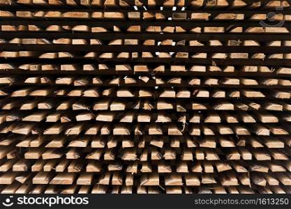 freshly cut wood stacked for lumber air drying background pattern