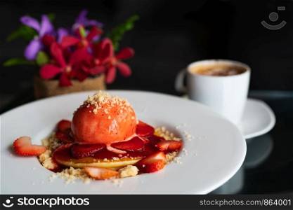 freshly homemade Pancakes Strawberry Crumble on white dessert plate