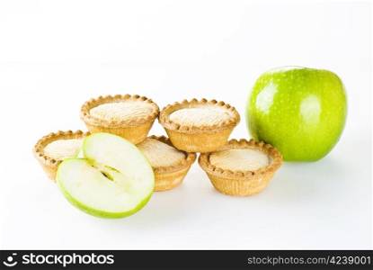 Freshly made apple pies over white background