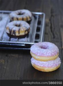 Freshly made donuts on the table of pastry