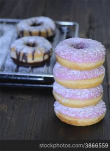 Freshly made donuts on the table of pastry