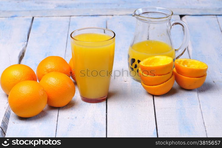 Freshly made orange juice on kitchen table.