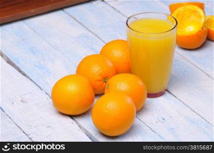Freshly made orange juice on kitchen table.