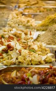 Freshly prepared oriental dishes on a market stall