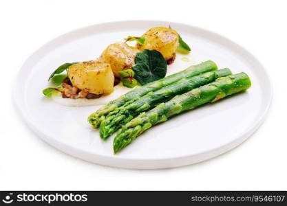 Freshly sauteed scallops with green asparagus