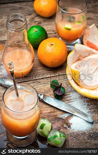 freshly squeezed citrus juice from oranges and tangerines.Selective focus. fresh orange juice