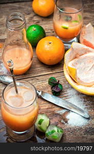 freshly squeezed citrus juice from oranges and tangerines.Selective focus. fresh orange juice