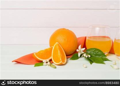 Freshly squeezed orange juice on wood background
