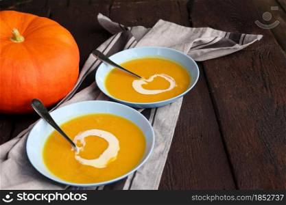 Freshness soup with pumpkin for autumn dinner on rustic table .. Freshness soup with pumpkin for autumn dinner on rustic table