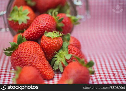 Frest tasty ripe Summer strawberries in glass jar