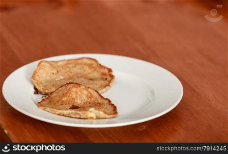 Fried apple in pancake dough or apple fritters pancakes with icing sugar
