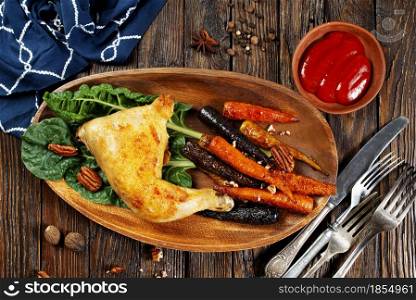 fried baby carrot with chicken leg on plate