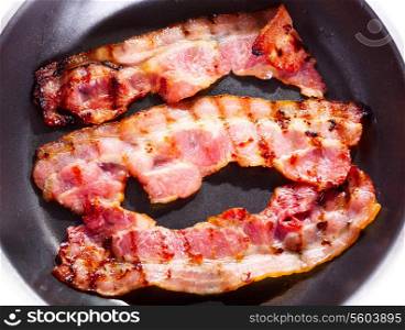 fried bacon in a pan