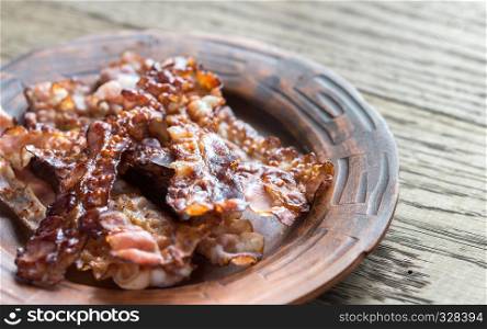 Fried bacon strips on the plate