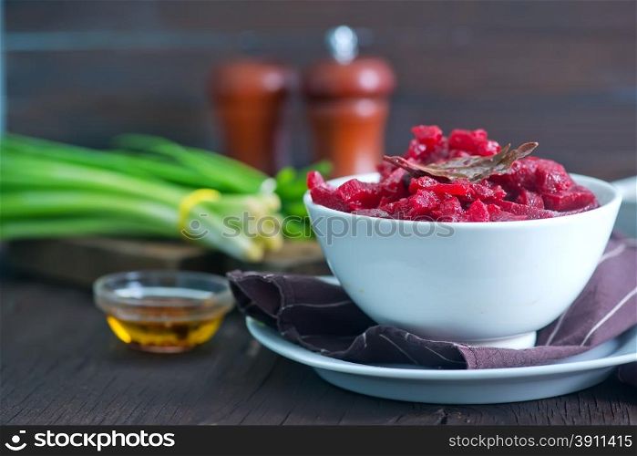 fried beet in white bowl and on a table