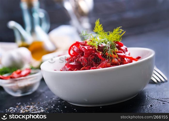 fried beet with garlick in bowl, beet salad