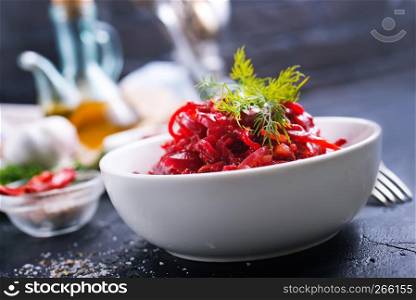fried beet with garlick in bowl, beet salad