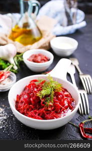 fried beet with garlick in bowl, beet salad