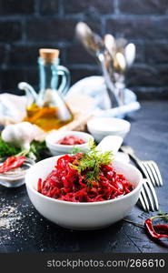 fried beet with garlick in bowl, beet salad