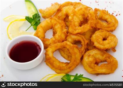 Fried calamari rings served with sauce
