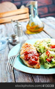 fried chicken breast with fresh salad and sauce