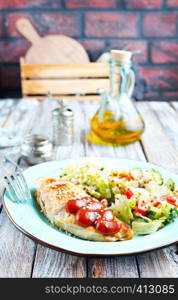 fried chicken breast with fresh salad and sauce