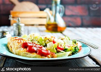 fried chicken breast with fresh salad and sauce