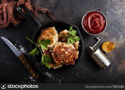 fried chicken cutlets with tomato sauce in bowl