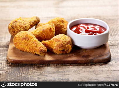 fried chicken on a wooden board