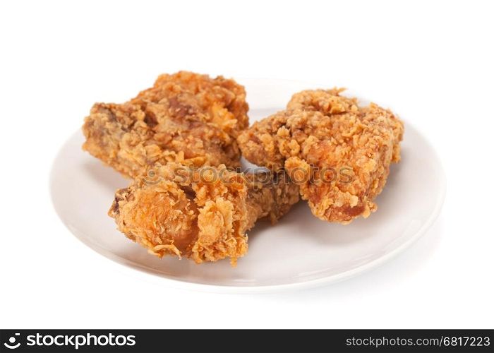 Fried chicken on dish isolated in white background