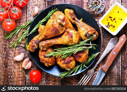 fried chicken on plate and on a table