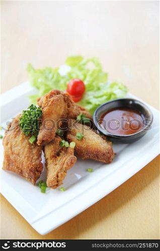 Fried chicken on wood background