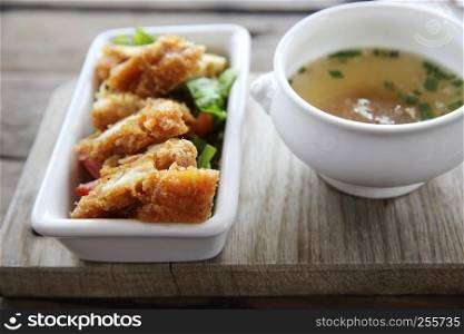 Fried chicken on wood background