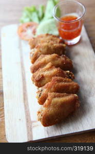 Fried chicken on wood background